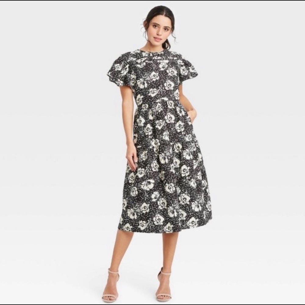 Beautiful classy black and white midi dress with flutter sleeves!